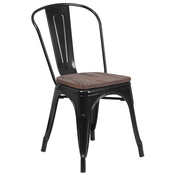 A Flash Furniture black metal stackable restaurant chair with a wooden seat.