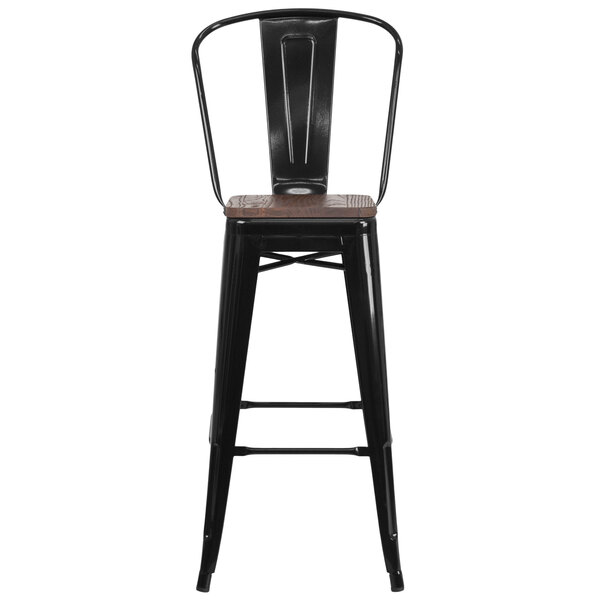 A black metal restaurant bar stool with a wood seat.