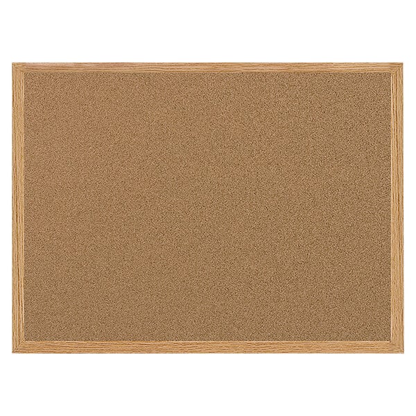 A MasterVision cork board with an oak frame.