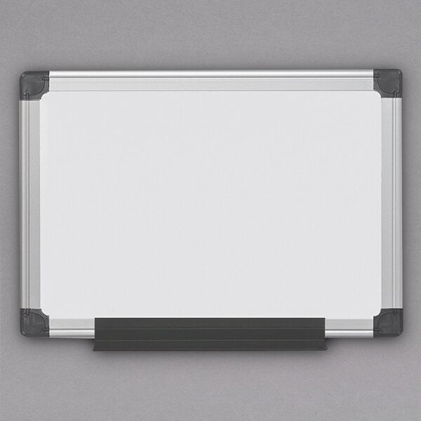 A MasterVision white board with a black frame and black corners.