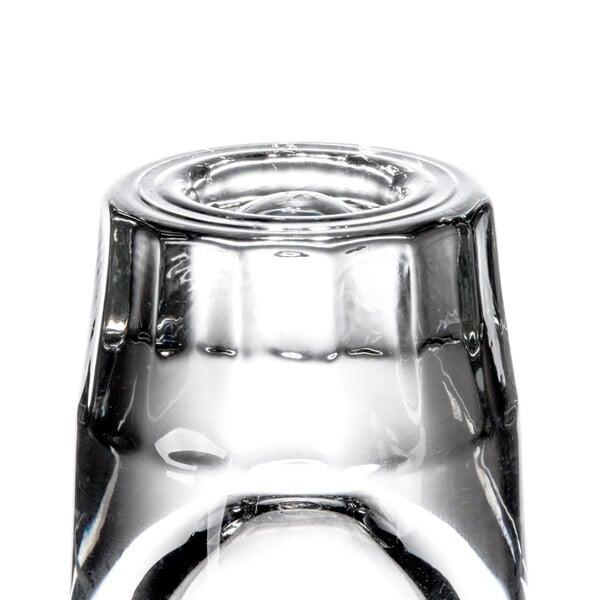 A Libbey fluted shot glass with a pour line on a white background.