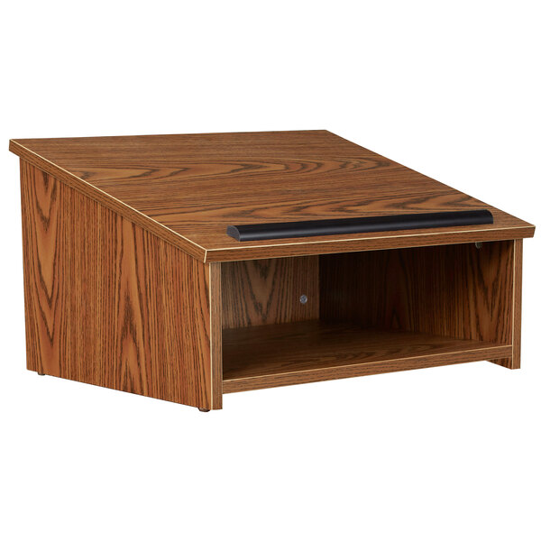 A wooden podium with a black handle on top.