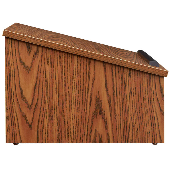 A wooden podium with a black handle.