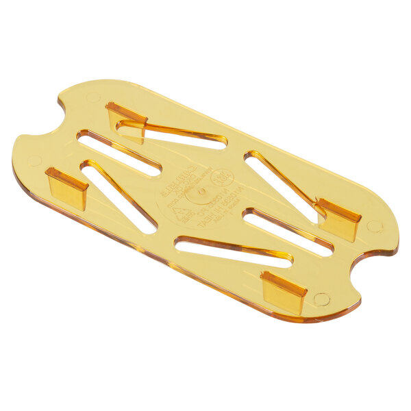 A Carlisle amber plastic drain tray with holes.