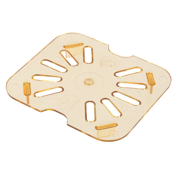 A Carlisle amber plastic drain tray with holes.