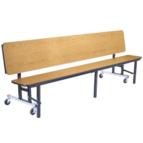 A wooden bench with black legs and wheels.