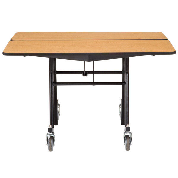 A National Public Seating square cafeteria table with wheels and a chrome frame.