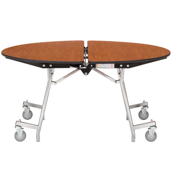 A National Public Seating cafeteria table with wheels and a metal frame.