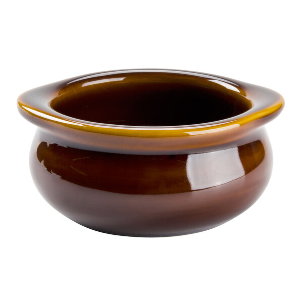 A close up of a brown Tuxton china bowl with a yellow rim.