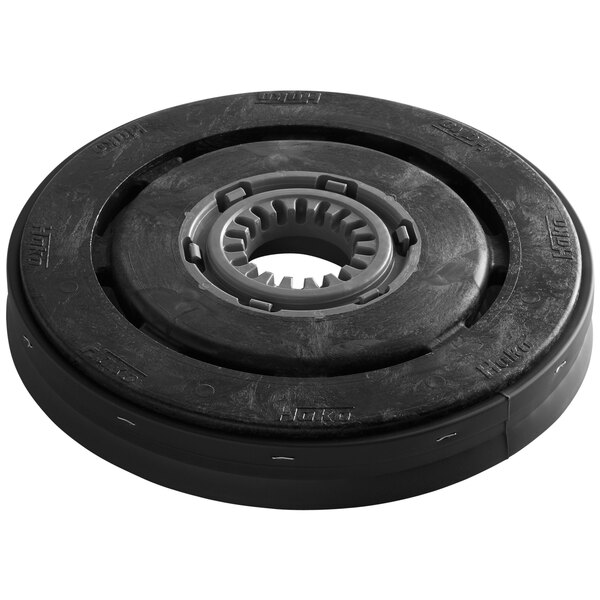 A black round disc brush with a grey circle on a metal ring.