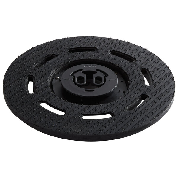 A black Minuteman 7524 pad driver disc with holes in it.