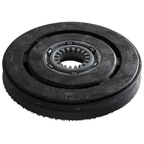 A black circular Minuteman disc brush with a grey center.