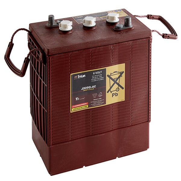 A brown Minuteman 6V battery with white wires.