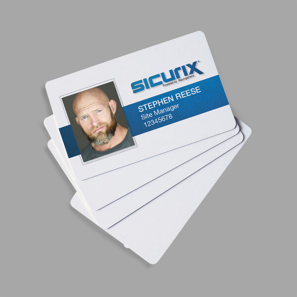 A stack of white SICURIX blank ID cards.