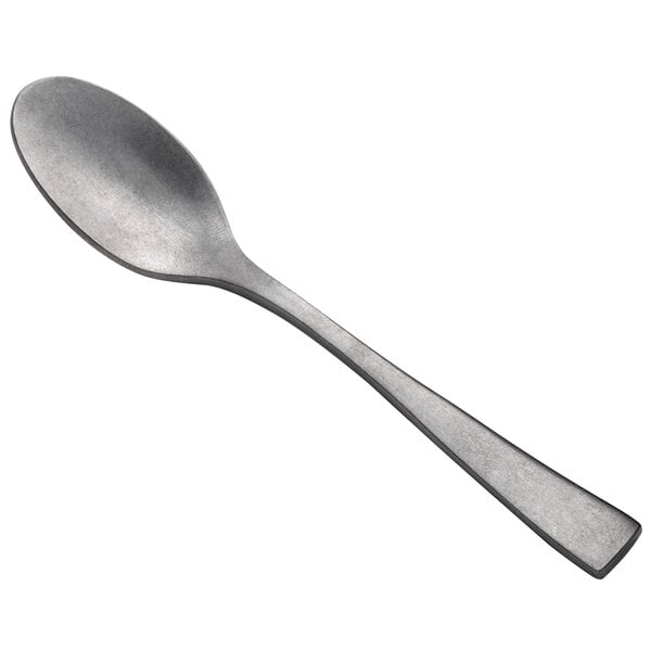 A close-up of a Oneida Lexia stainless steel demitasse coffee spoon with a metal handle.