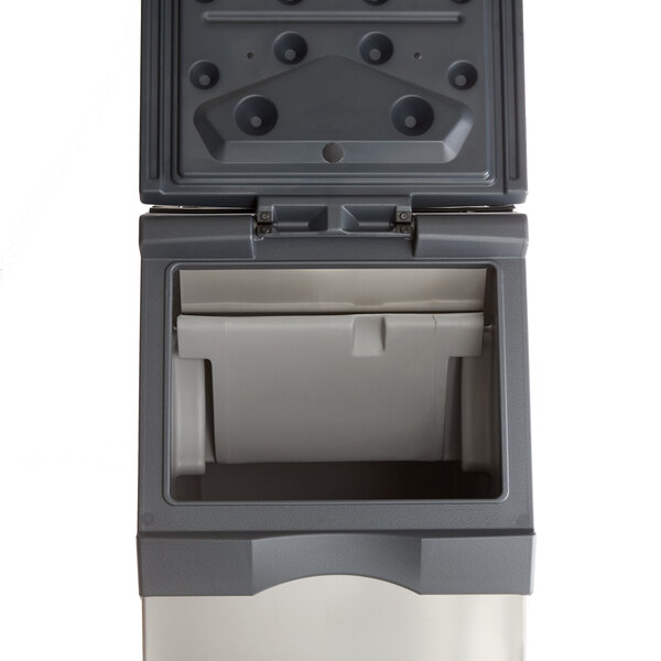A grey plastic Scotsman medium cube ice machine with a lid open.