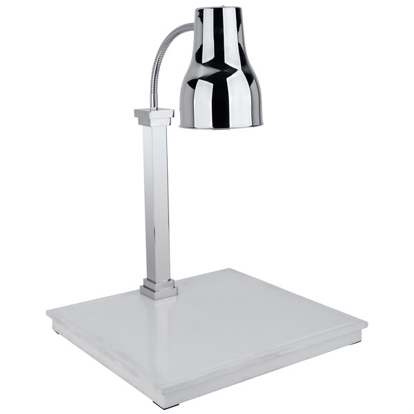 A silver and black Bon Chef carving station lamp on a white marble base.
