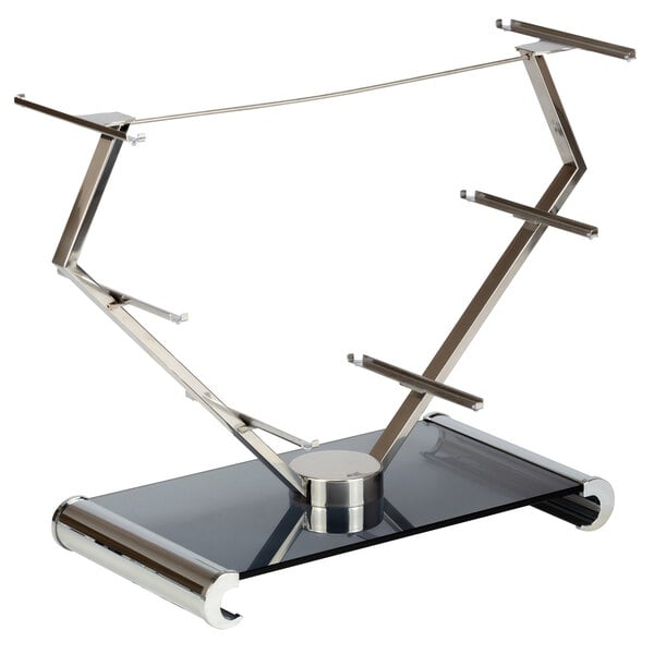 A silver metal and glass Bon Chef display stand.