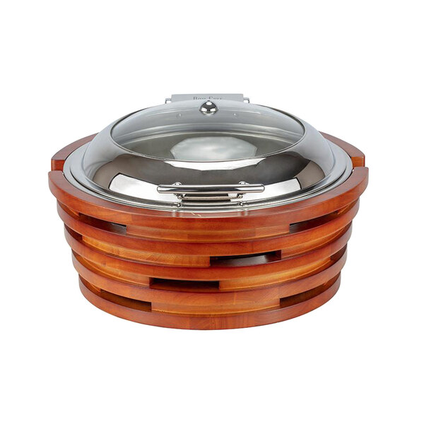 A round wooden and silver Bon Chef chafer with a clear glass lid.