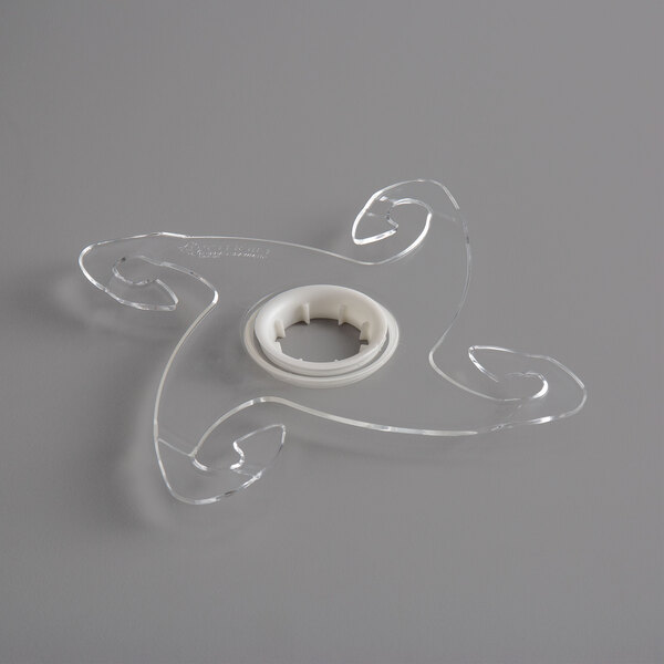 A clear plastic star shaped object with holes.