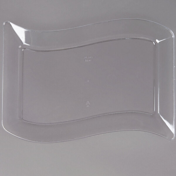 A clear plastic plate with a curved edge.