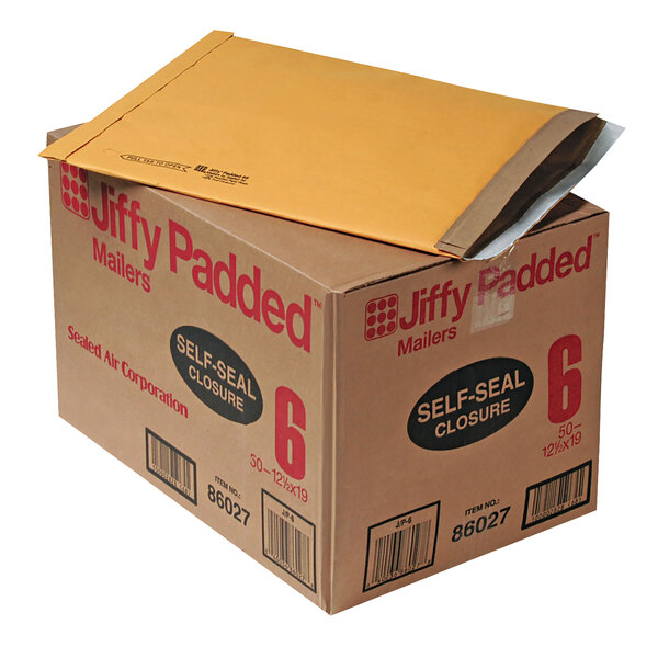 A brown box with a yellow Jiffy padded envelope on top.