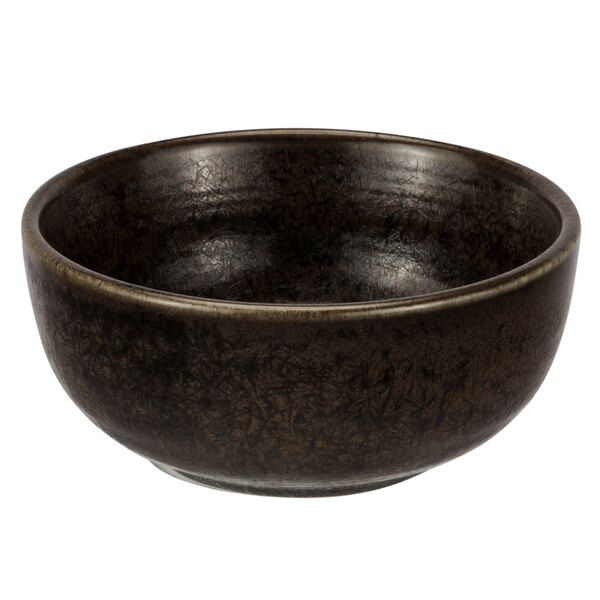 A brown soup bowl with a black speckled rim.