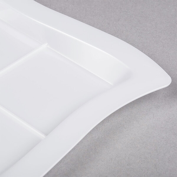 A white rectangular disposable plastic tray with a curved edge.