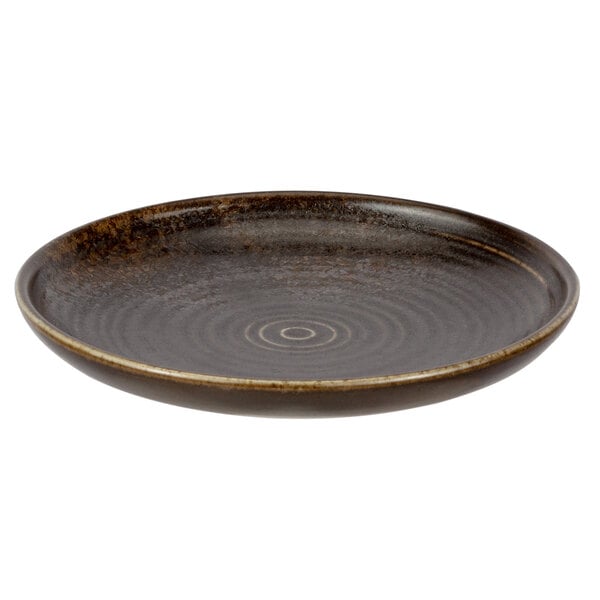 A brown Bon Chef Tavola Eros bread and butter plate with a spiral pattern.
