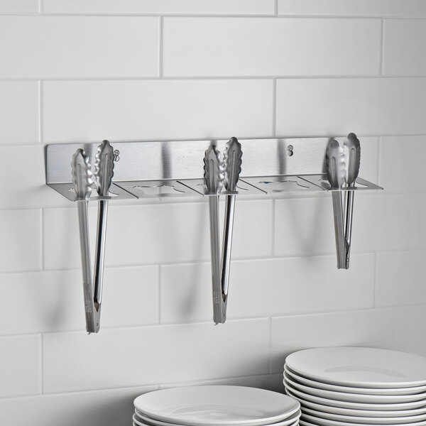 A stainless steel Edlund Smart Tong holder on a white background.