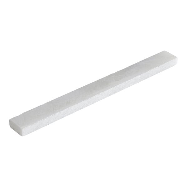 A rectangular white soapstone chalk stick.