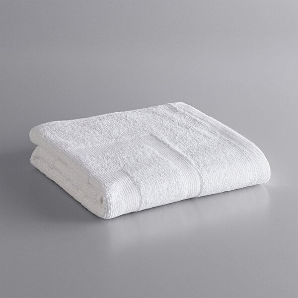 A white Lavex bath mat on a gray surface.