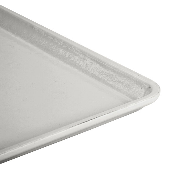 A taupe Cambro dietary tray with a metal handle.