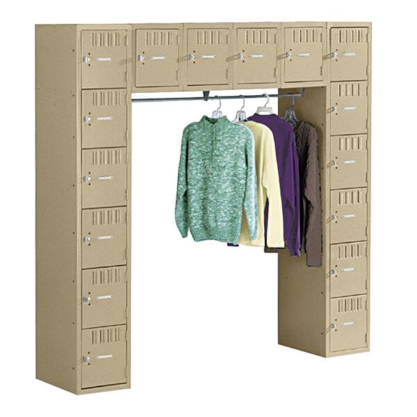 A Tennsco sand steel locker with a coat bar.