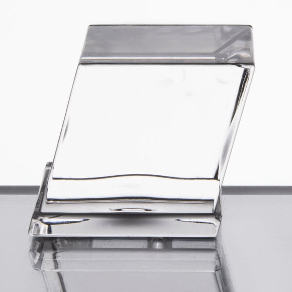 A Manitowoc air cooled ice machine with a clear glass cube on top.