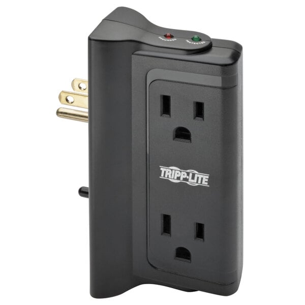 A close-up of a black Tripp Lite power strip with a green light.