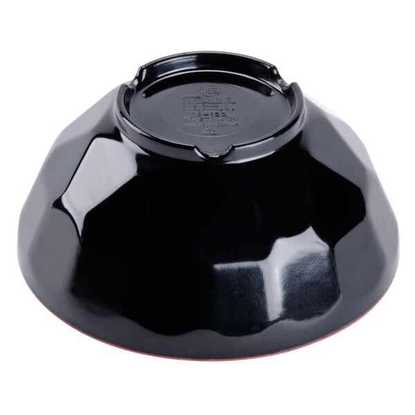 A black bowl with a red edge.