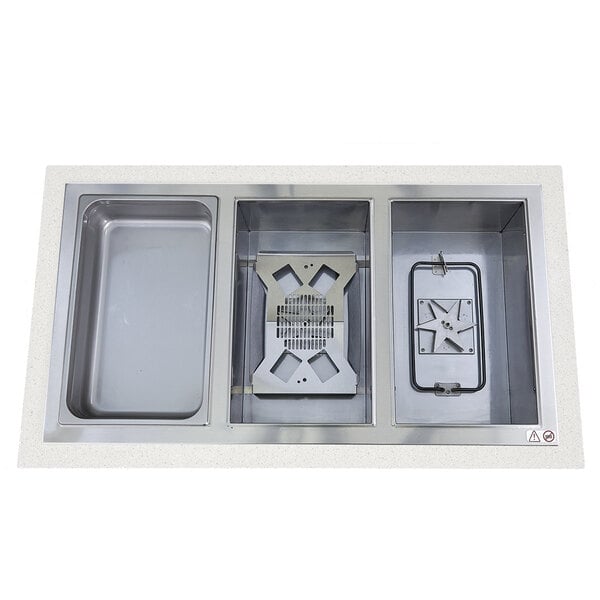 A Wells drop-in hot food well with two rectangular stainless steel pans.