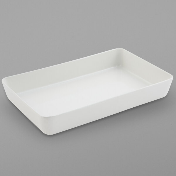 A white rectangular Bon Chef casserole on a white surface.