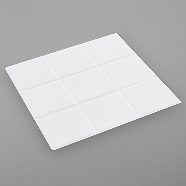 a white square object on a gray surface