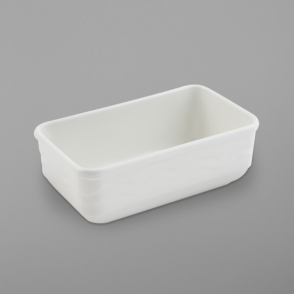 A white rectangular Bon Chef rimmed casserole with a sandstone finish.