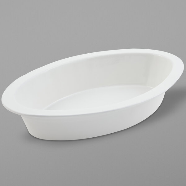 A white oval shaped Bon Chef cast aluminum casserole.