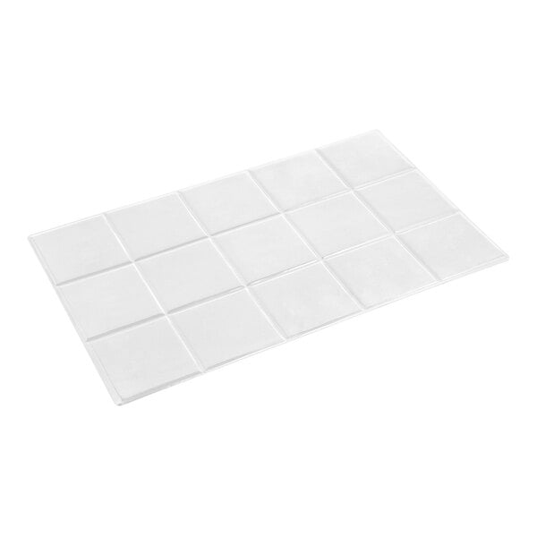 A rectangular white tile with a grid pattern of raised square sections.