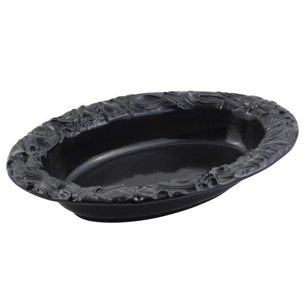 A black oval Bon Chef pasta bowl with a design.