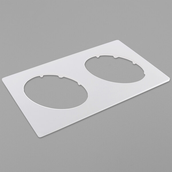 A white plastic Bonstone tile with two circles.