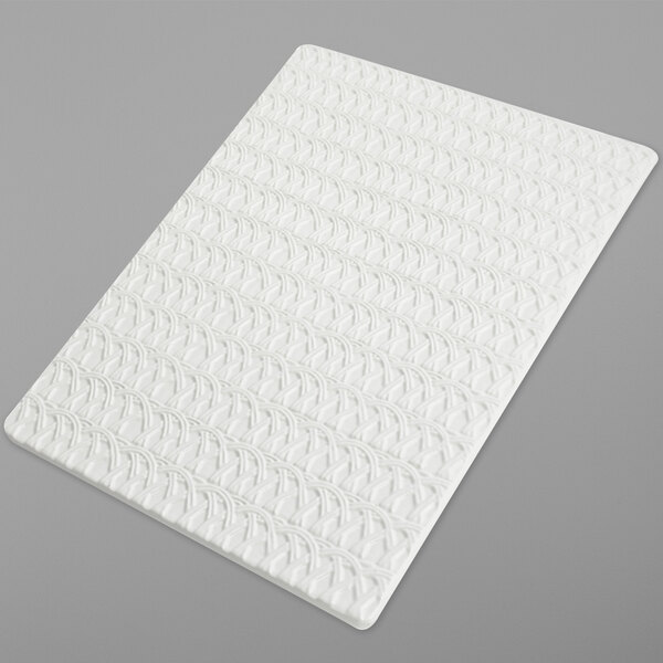 A white Bon Chef sandstone tile with a pattern on it.