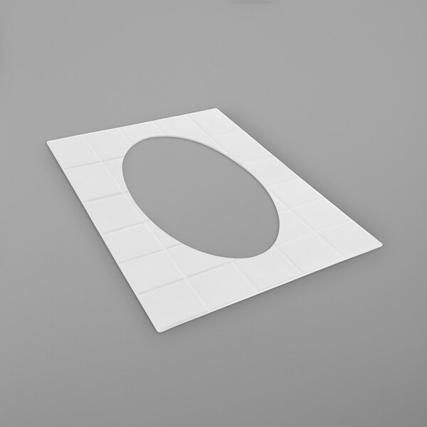 A white rectangular object with a round hole in the middle.