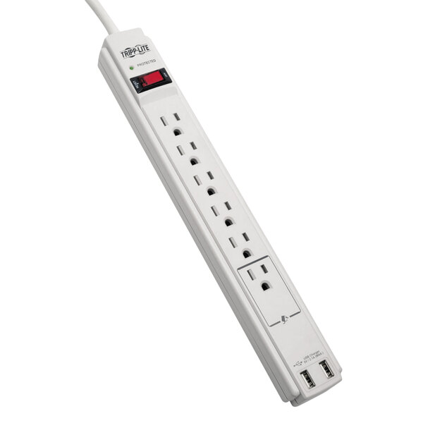 A close-up of a white Tripp Lite surge protector with multiple outlets and a red light on it.