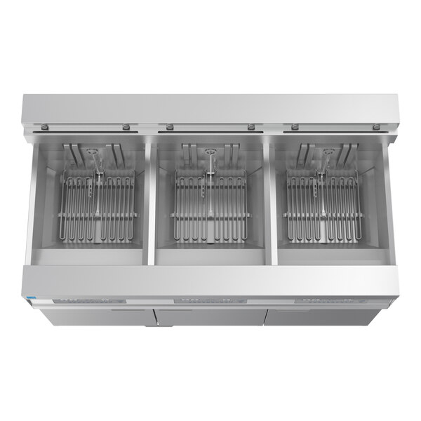 A commercial three-unit electric floor fryer with oil-conserving and filtration features.