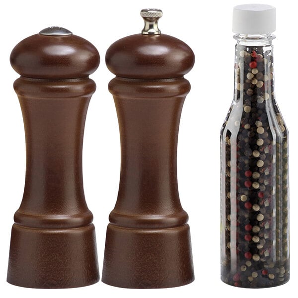 A brown walnut salt shaker and pepper mill set.